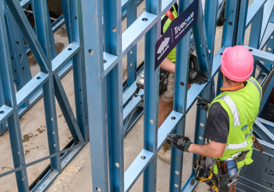 Builders handling frames made from TRUECORE<sup>®</sup> steel